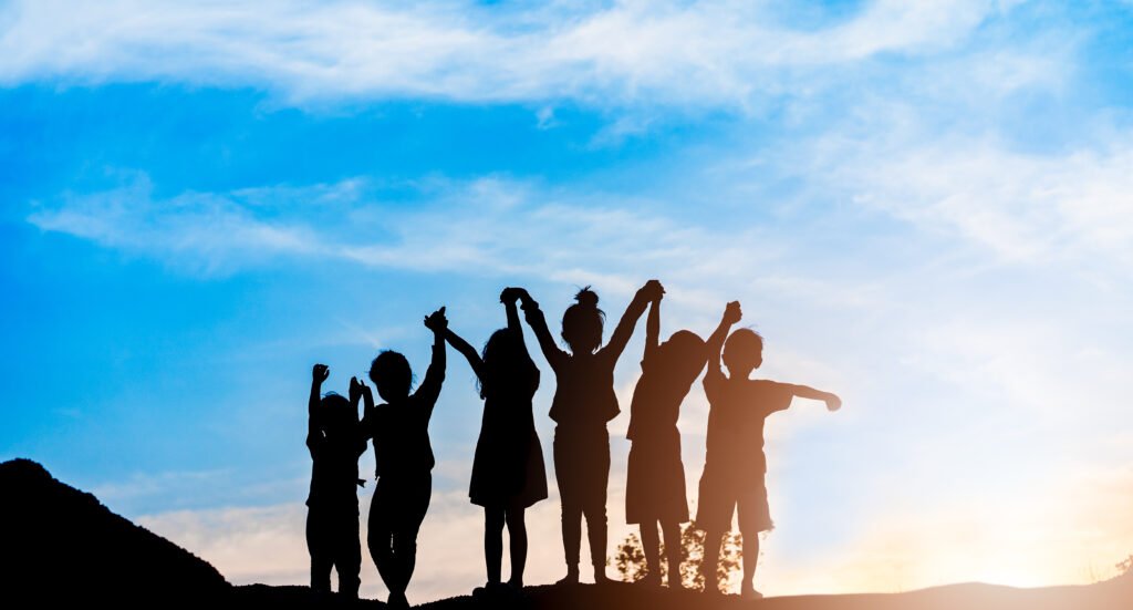 Children standing together symbolising confidence and support for bedwetting treatment in children