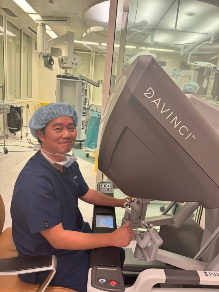 Dr Roger Anthony Idi performing robotic surgery using the da Vinci surgical system