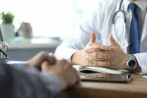 Doctor discussing focal therapy options for prostate cancer with a patient
