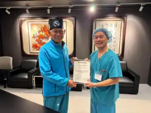 Dr Roger Anthony Idi with Professor Yen-Chuan Ou following completion of an international clinical attachment in Taiwan.