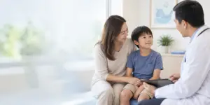 Child with parent during a paediatric urology consultation for kidney stones