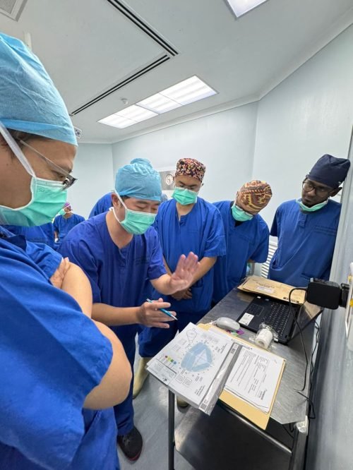Dr Roger Anthony Idi explaining transperineal prostate biopsy planning and sampling strategy to urologists during a hands-on training workshop.